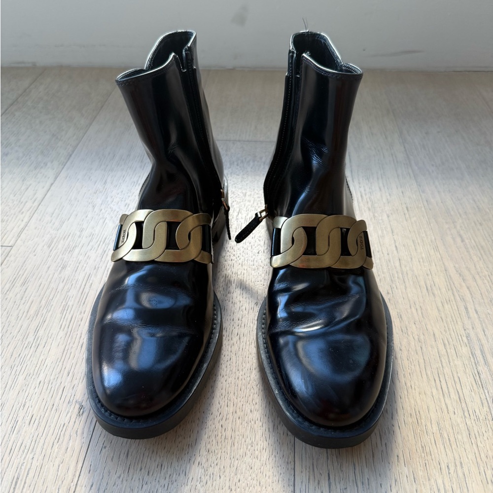 Tod's Black Ankle Boots with Gold Accent